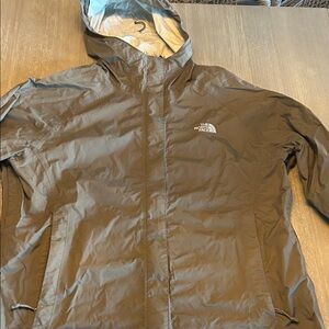 The North Face woman’s tan Raincoat